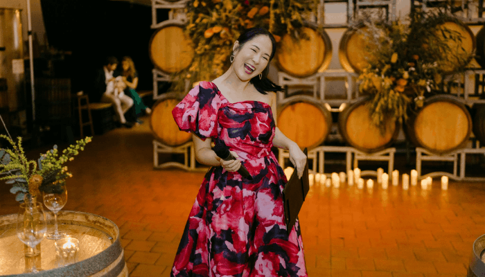 Wedding MC in Melbourne hosting reception with microphone