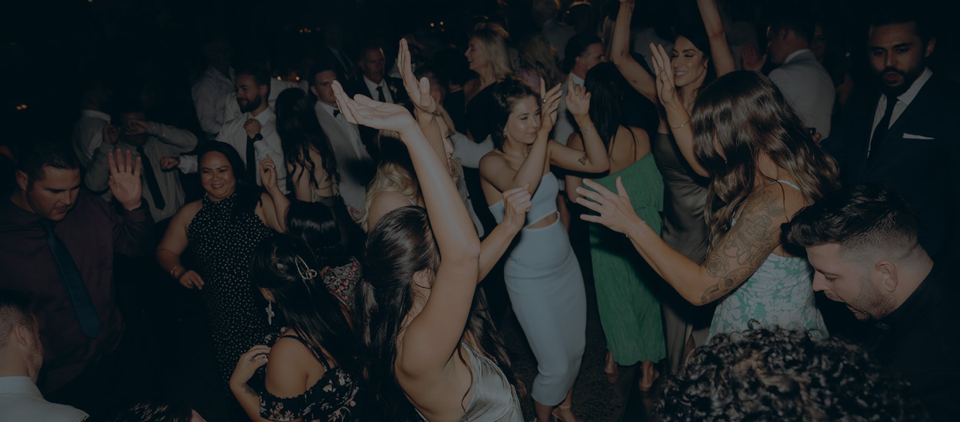 Guests dancing with LED sticks at a Melbourne private function — DJ Emily Gracie