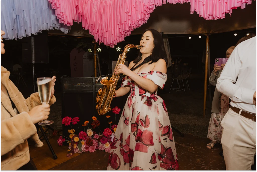 DJ Emily Gracie playing saxophone at a Melbourne private function